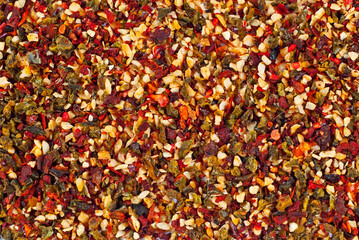 A mixture of different spices close up. Textures of colorful spices and condiments.