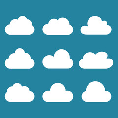 White cartoon clouds set isolated on blue background. Collection of different cartoon clouds for background template, wallpaper and sky design. Cartoon clouds vector. Sky illustration