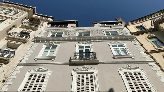 Footage of traditional, historical buildings in Cukurcuma area of Taksim / Beyoglu district of Istanbul. It is an old neighborhood housing antique stores art galleries. It is a sunny summer day.