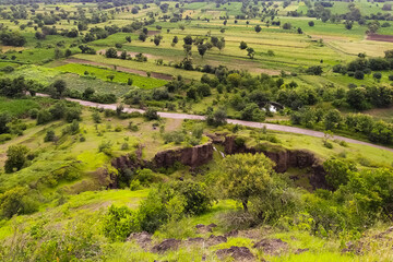 Road passing through excavated mine green farmland