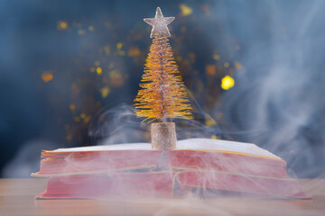 image of book smoke fir tree dark background 