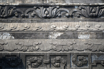 Surface Ancient Sculpture Black wall of Royal Tomb of Khai Dinh King architecture of the city of Hue Vietnam   