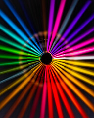 Vivid colourful abstract art background with a rainbow of colours with a wheel or circle layout. Intentional camera movement creates 3D visual effect. Colourful wallpaper or background