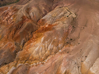 Aerial drone view of colorful eroded landform of Altai mountains in popular tourist location called Mars, Chagan-Uzun, Altai Republic, Russia