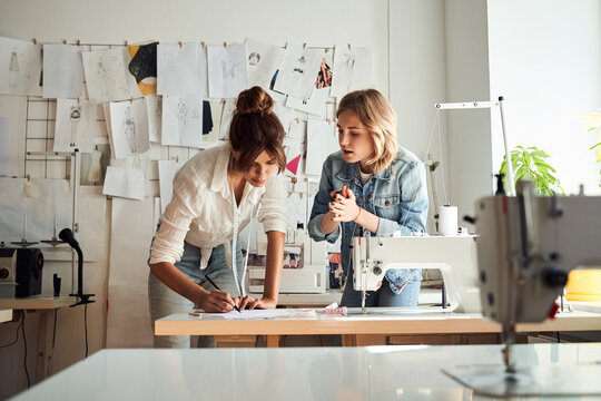 Designers discussing sketches