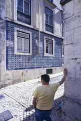 Obraz na płótnie Canvas facade covered with blue and white geometric azulejos in Bairro Alto in Lisbon, Portugal