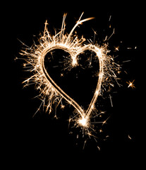 Bright sparkling heart contour on black background