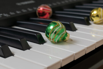 Piano keyboard. Musical background. Piano with red, green and yellow ball.