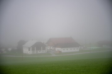 Houses in the fog from above