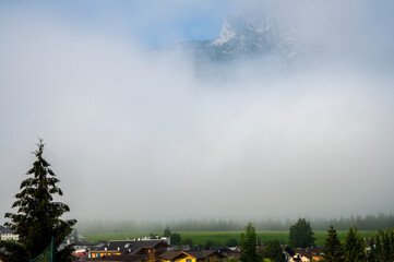 Austrian village on a foggy summer morning