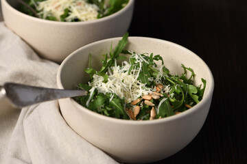  Arugula salad with sunflower kernels and sprinkled with grated parmesan