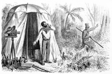 19th century photographer in the Amazonian jungle with his equipment and his assistant. Ancient grey tone etching style art by Maurand, published on Le Tour du Monde, Paris, 1861