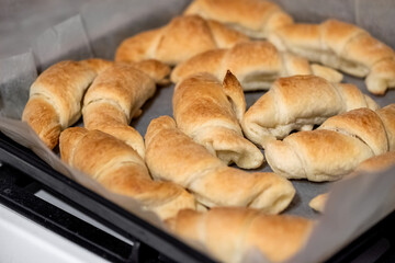 Homemade pastry. Fresh baked rolls on baking sheet