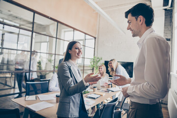 Naklejka premium Profile side photo of two business people investors man woman have talk say speak tell economy development plan wear formal clothes in workplace workstation
