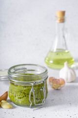 selective focus. Basil and cheese pesto paste