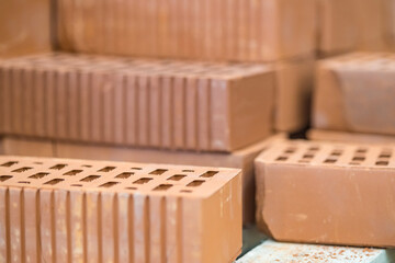 Fototapeta na wymiar Hollow ceramic bricks. Construction industry. For construction. Sale of building materials.