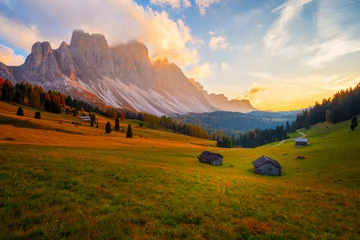 Fototapete Dolomiten Beautiful autumn colors at the foot of the Odle Mountains in the backdrop of the Seceda Mountains at sunset in the Dolomites, Trentino Alto Adige, Val di Funes Valley, South Tyrol