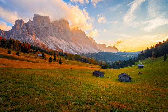 Beautiful autumn colors at the foot of the Odle Mountains in the backdrop of the Seceda Mountains at sunset in the Dolomites, Trentino Alto Adige, Val di Funes Valley, South Tyrol