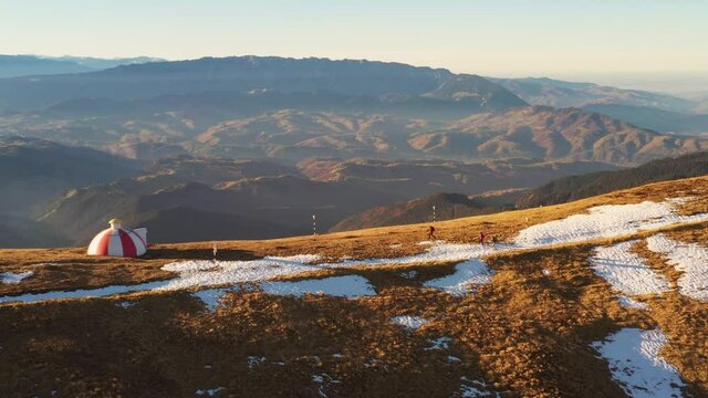 Drone 4k clip of Batrana mountain refuge high at 2170m in Bucegi Mountains, Romania, on a beautiful autumn day
