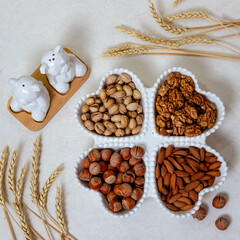 Different types of nuts and decorated plates