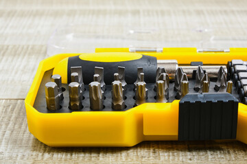 screwdriver and nozzles in a plastic box, copy place, screwdriver nozzles