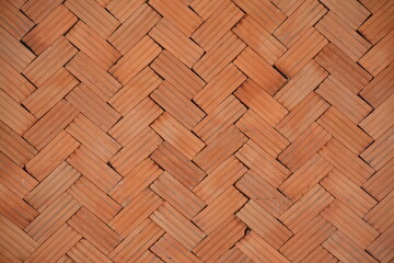 Red-Orange bricks tiled floor with zigzag pattern texture background.