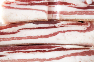 National Ukrainian food - salted pork lard with garlic and herbs, macro photo