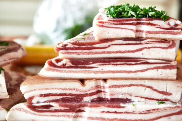 National Ukrainian food - salted pork lard with garlic and herbs, macro photo