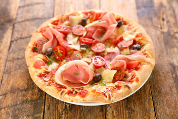 pizza with prosciutto ham with cheese and olive