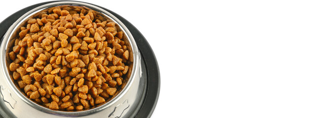 Dry dog treats in bowl isolated on white. Wide photo. Free space for text.