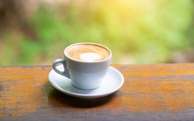 coffee cup and cake on wood table.