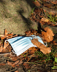 Pollution of nature with abandoned surgical mask.