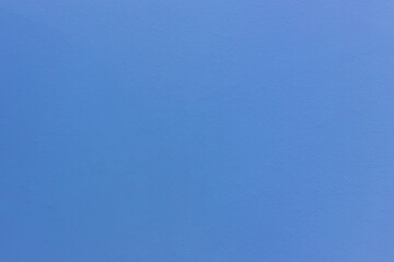 Blue sheet of cardboard paper with rough surface texture background. Textures on the blue wall use for background. Empty interior with blue wall or a blue floor.