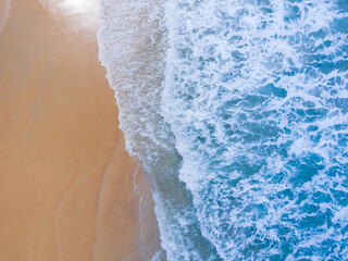 (Top view) Beach seawater wave on sandy beach. Background and travel concept.
