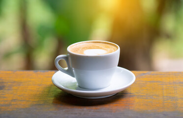 coffee cup and cake on wood table.