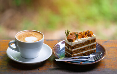 coffee cup and cake on wood table.