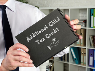 Financial concept meaning Additional Child Tax Credit with sign on the page.