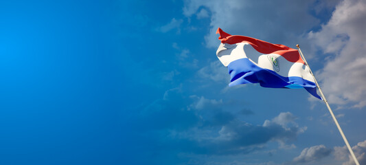 Beautiful national state flag of Paraguay with blank space.