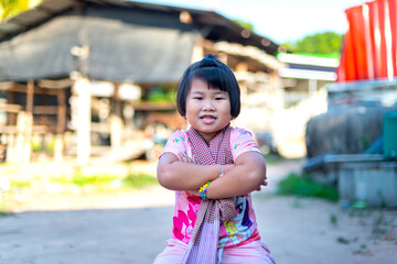 Portrait of happy joyful laughing Asian kid girl aged 4 to 6 years old. Cute face, bright, Short hair, smiling cute.