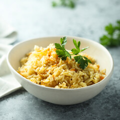 Homemade spicy rice with carrot and parsley