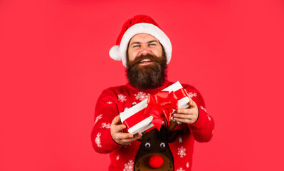 Open present. Christmas gift. Christmas surprise tradition. Spreading warmth. Boxing day. Keep calm and winter on. Prosperity and wellbeing. Shopping concept. Santa Claus bearded man. Merry Christmas