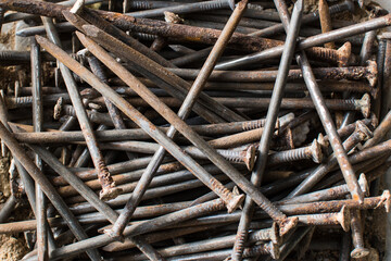 Many old rusted nails. Corroded iron nails closeup background. Recycling iron concept.