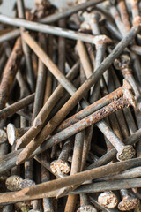 Many old rusted nails. Corroded iron nails background. Recycling iron concept. Closeup view.