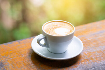 coffee cup and cake on wood table.