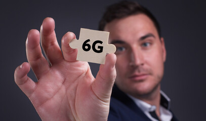 Business, Technology, Internet and network concept. Young businessman shows the word: 6G