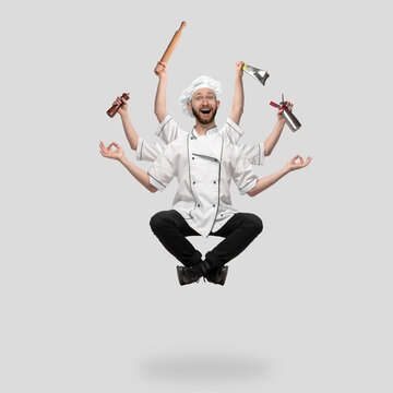 Cooker, chef, baker in uniform like shiva isolated on gray studio background, gourmet. Young man, restaurant cook multitasked. Business, food, professional occupation, time concept. Copyspace for ad.