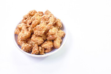 crispy sweet peanut coating syrup and dressing sesame on white background