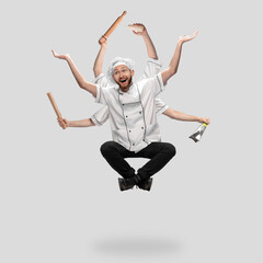 Cooker, chef, baker in uniform like shiva isolated on gray studio background, gourmet. Young man,...
