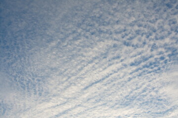 white fluffy clouds in the blue sky