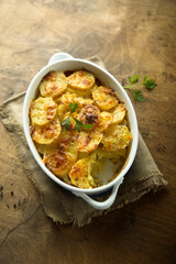 Traditional homemade potato gratin with cheese